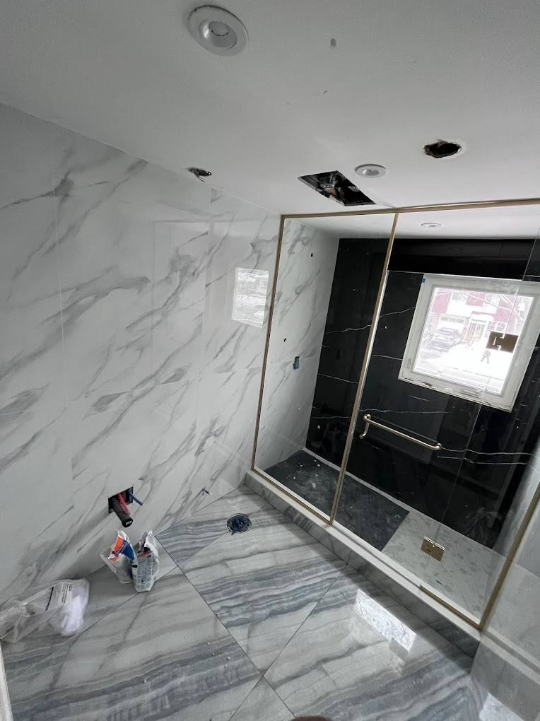 Marble ensuite in progress in Muskoka — real Northern Oaks Contracting project photo